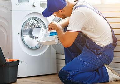 man doing washing machine repair